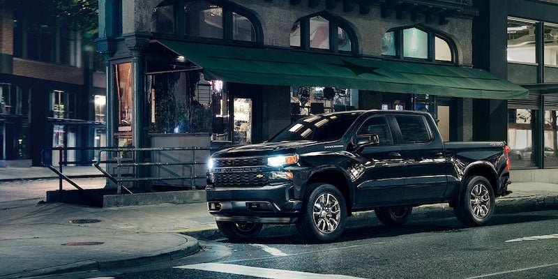 Black Silverado standing internal city road side