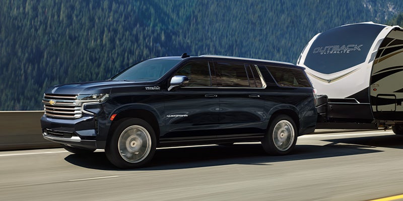 2024 Chevrolet Suburban hauling a trailer