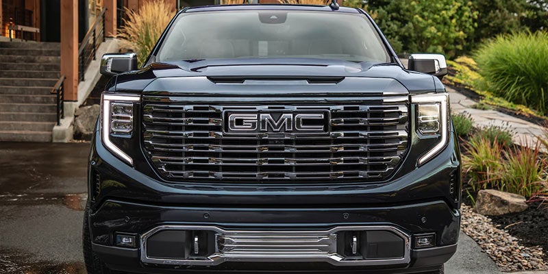 Black GMC Sierra front view with bold grille design