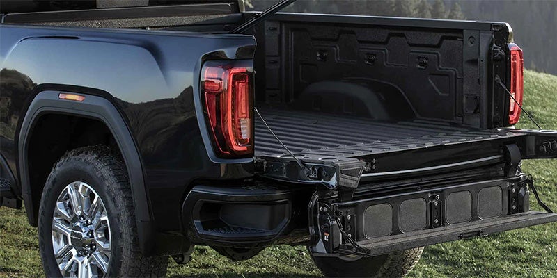 GMC Sierra HD with Multi Pro tailgate open, showcasing truck bed