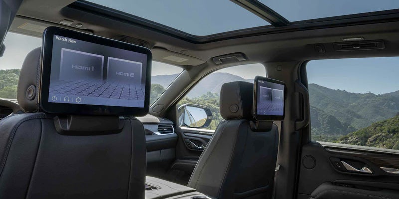 Multimedia screens at backside of front seats of GMC Yukon